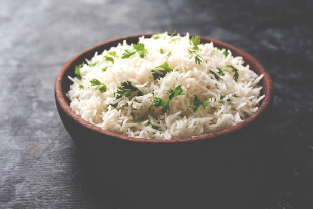 istock Coriander or cilantro Basmati Rice, served in a ceramic or terracotta bowl. It's a popular Indian OR Chinese recipe. Selective focus 1024607892