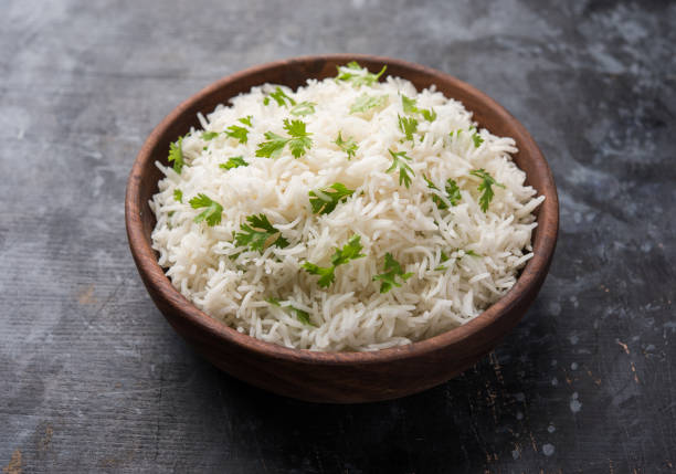 istock Coriander or cilantro Basmati Rice, served in a ceramic or terracotta bowl. It's a popular Indian OR Chinese recipe. Selective focus 1024608008