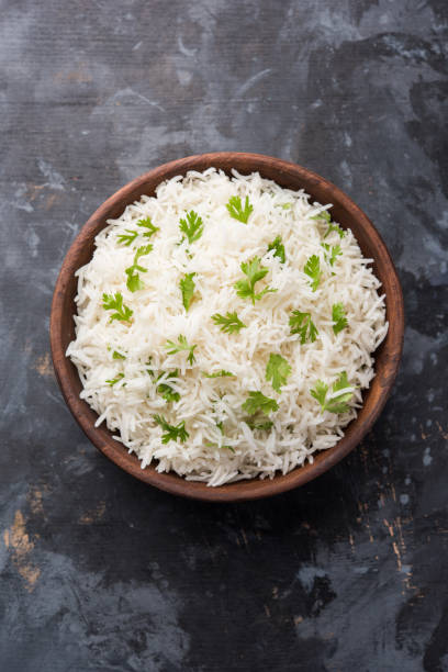 istock Coriander or cilantro Basmati Rice, served in a ceramic or terracotta bowl. It's a popular Indian OR Chinese recipe. Selective focus 1024608068
