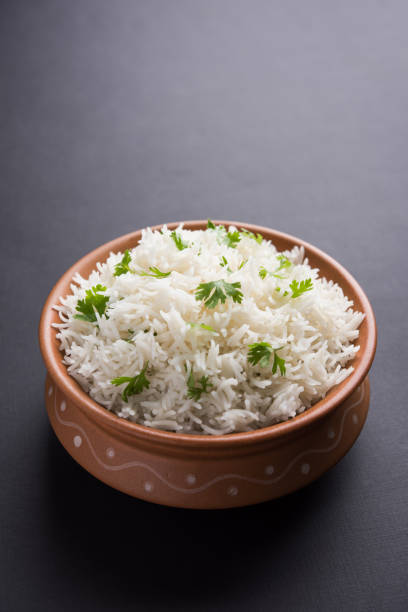 istock Coriander or cilantro Basmati Rice, served in a ceramic or terracotta bowl. It's a popular Indian OR Chinese recipe. Selective focus 1024610202