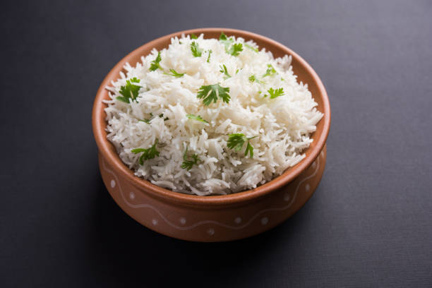 istock Coriander or cilantro Basmati Rice, served in a ceramic or terracotta bowl. It's a popular Indian OR Chinese recipe. Selective focus 1024612334