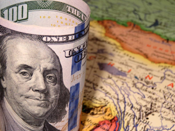 istock US dollars on the China map background, selective focus 1024612386