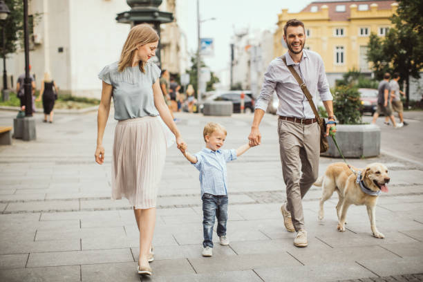 istock Family walking dog 1024612404