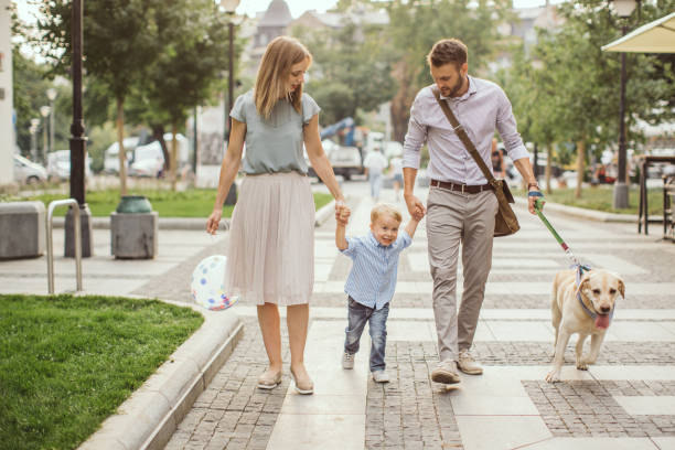 istock Family walking dog 1024612432