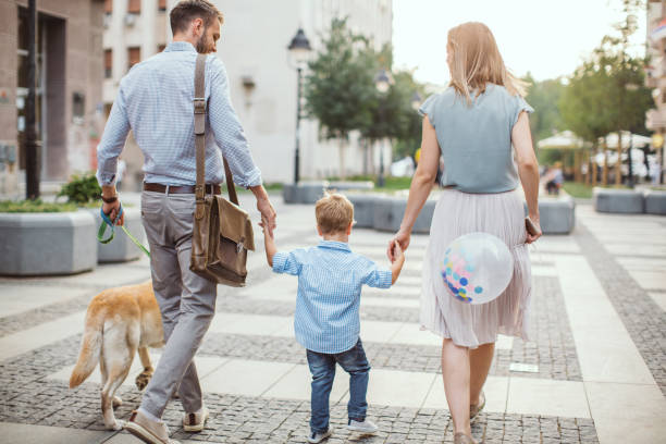 istock Family walking dog 1024612434