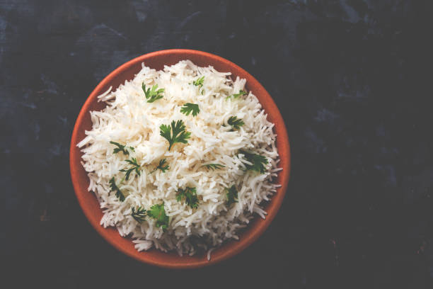 istock Coriander or cilantro Basmati Rice, served in a ceramic or terracotta bowl. It's a popular Indian OR Chinese recipe. Selective focus 1024612850