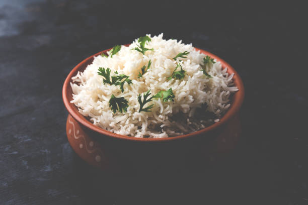 istock Coriander or cilantro Basmati Rice, served in a ceramic or terracotta bowl. It's a popular Indian OR Chinese recipe. Selective focus 1024612866