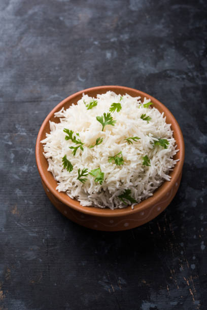 istock Coriander or cilantro Basmati Rice, served in a ceramic or terracotta bowl. It's a popular Indian OR Chinese recipe. Selective focus 1024613082
