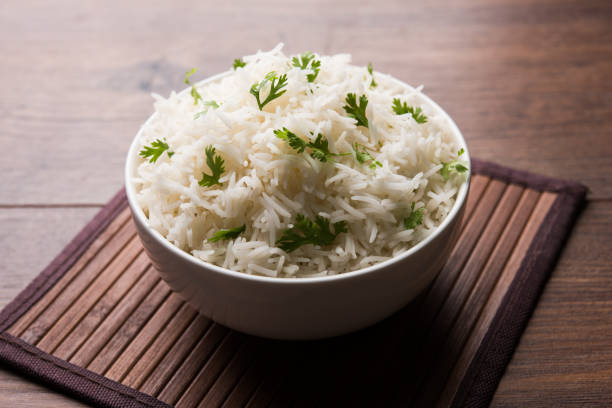 istock Coriander or cilantro Basmati Rice, served in a ceramic or terracotta bowl. It's a popular Indian OR Chinese recipe. Selective focus 1024613676