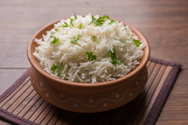istock Coriander or cilantro Basmati Rice, served in a ceramic or terracotta bowl. It's a popular Indian OR Chinese recipe. Selective focus 1024615934