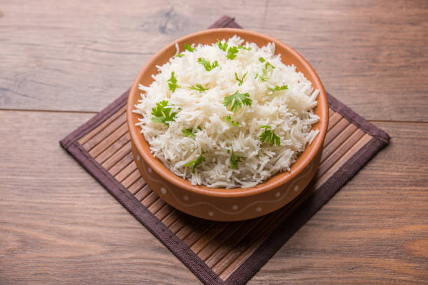 istock Coriander or cilantro Basmati Rice, served in a ceramic or terracotta bowl. It's a popular Indian OR Chinese recipe. Selective focus 1024616080
