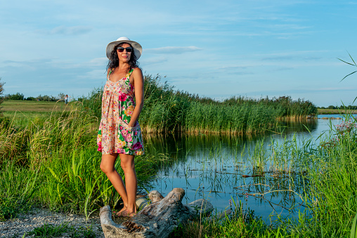 Posing in flower dress at sunset at the Danube near Samorin, SK