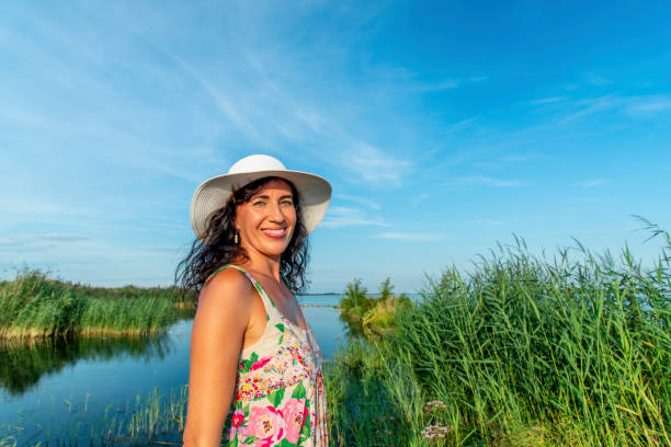 Posing in flower dress at sunset at the Danube near Samorin, SK