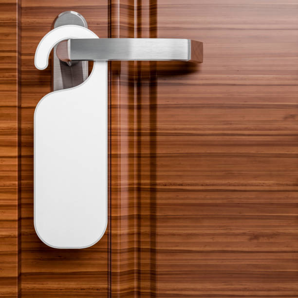 istock hotel door with paper label 1024630104