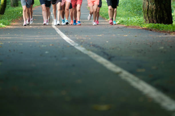 istock Feet group athletes running marathon in woods 1024634270