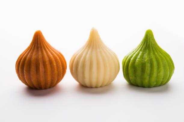 Sweet Tiranga coloured modak shape mithai or dumpling for Independence or republic day greeting card