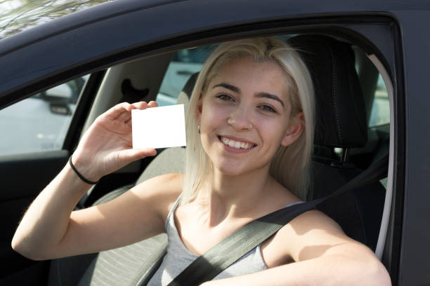 istock Driver of a blank card inside a car 1024638092