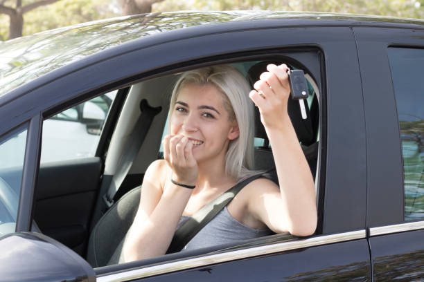 istock Happy owner holding keys looking at camera 1024638108