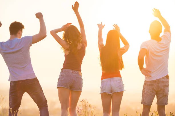 istock The four people dancing on the sunset background 1024640840