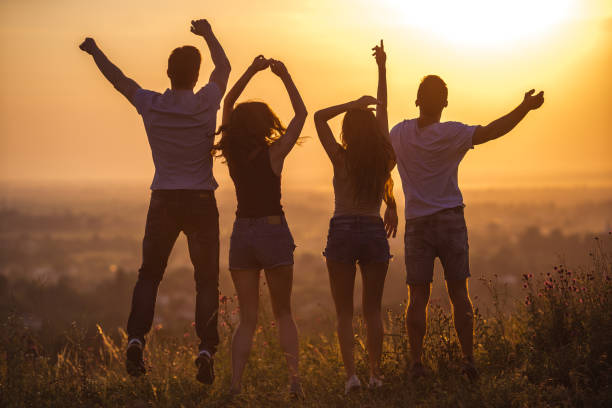 istock The four people jumping on the sunrise background 1024641072