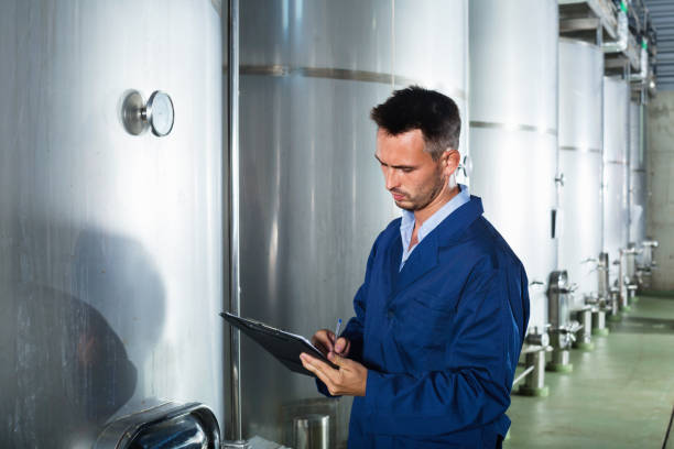 istock Portrait of  man wearing coat taking off data from equipment 1024652660
