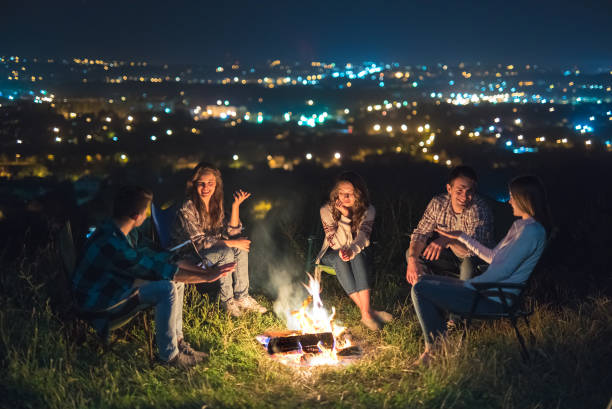 istock The people rest near the camping bonfire. evening night time 1024652844