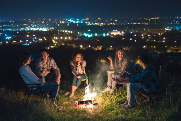 istock The people rest near the camping bonfire. evening night time 1024652880