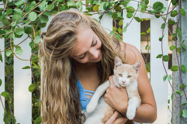 istock Girl cuddling with kitty 1024653598