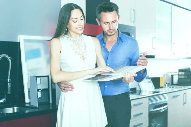 istock middle class positive family selecting kitchen furniture 1024653894