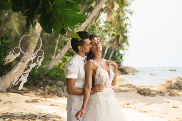 istock Young and beautiful couple is celebrating wedding on the beach 1024667146