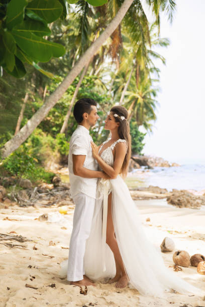 istock Young and beautiful couple is celebrating wedding on the beach 1024667192