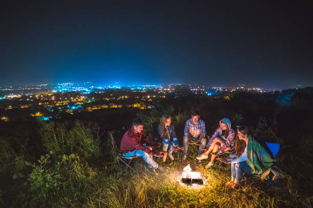istock The five people warming near the bonfire. evening night time 1024667208
