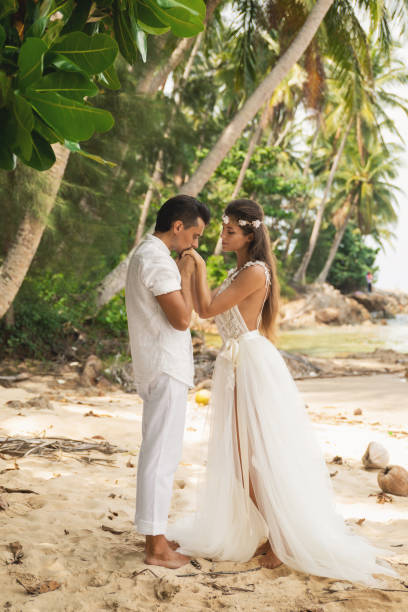 istock Young and beautiful couple is celebrating wedding on the beach 1024667276