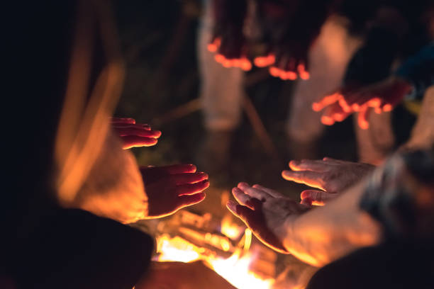 istock The people warming hands near the bonfire. night time 1024667366