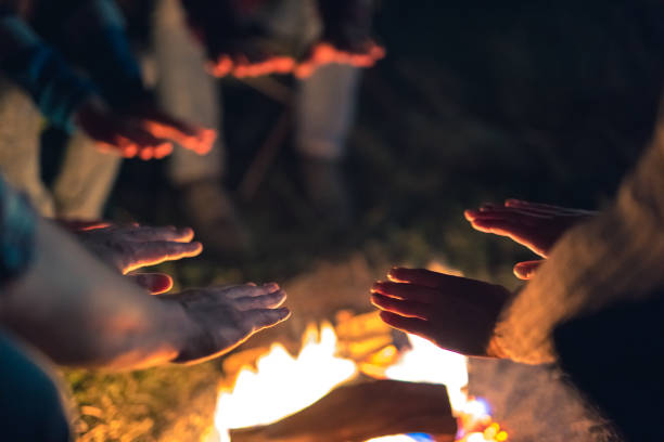 istock The people warming hands near the bonfire. evening night time 1024667374