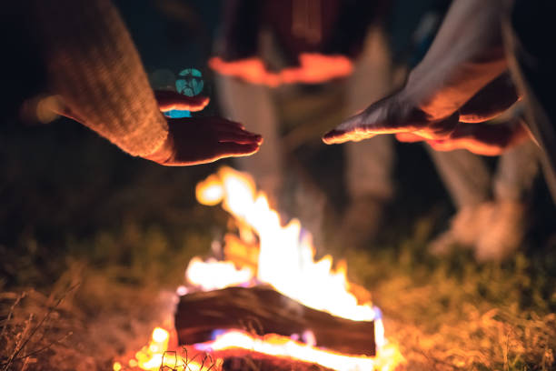 istock The people warming hands near the bonfire. evening night time 1024667382