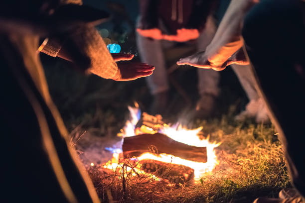 istock The people warming hands near the bonfire. night time 1024667394