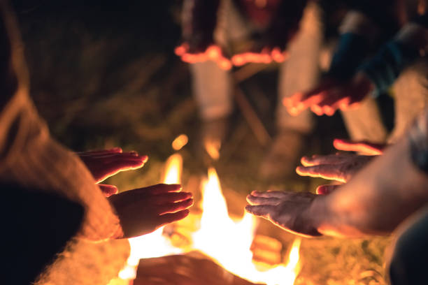 istock The people warming hands near the bonfire. evening night time 1024667438