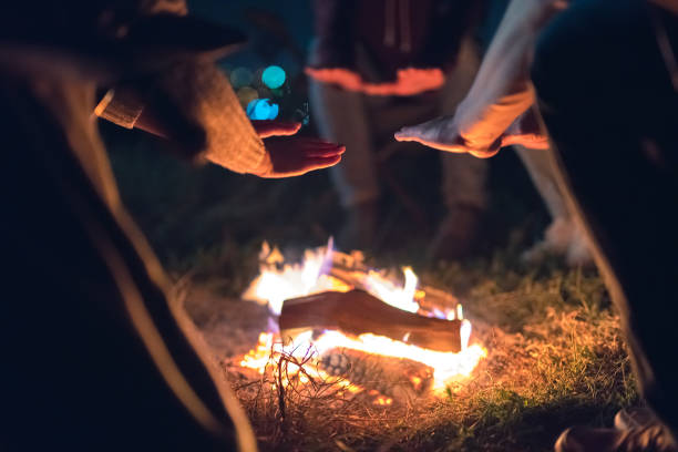 istock The people warming hands near the bonfire. evening night time 1024667456