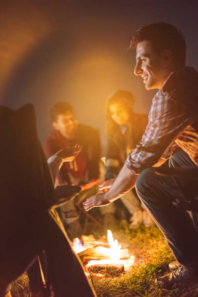 istock The people warming hands above the bonfire. evening night time 1024669948