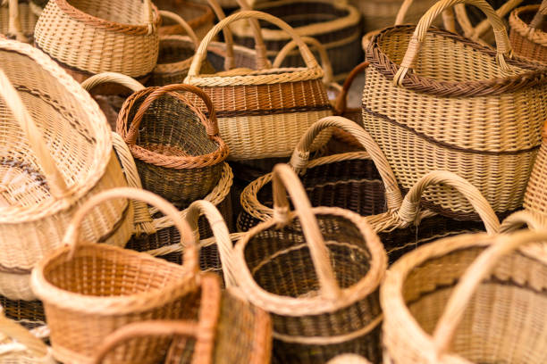 istock Hand made wicker woven baskets on display in a city fare. Handmade crafts 1024670578
