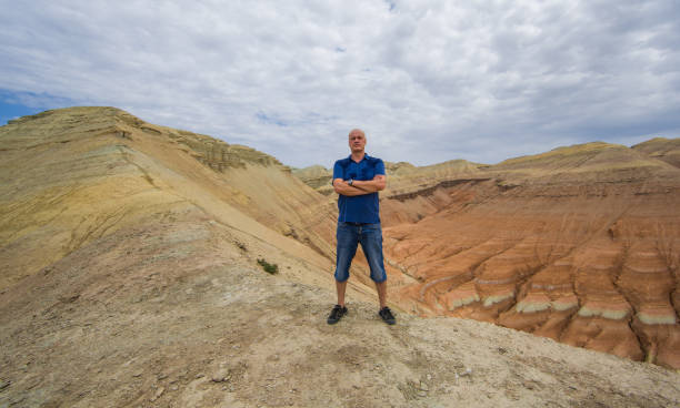 istock man on top of volcano in summer 1024673740