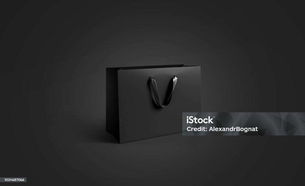 Blank black paper bag with silk handle mockup, isolated Blank black paper bag with silk handle mockup, isolated, pd rendering. Empty gift pack mock up. Carry shopping sack in darkness template Bag Stock Photo