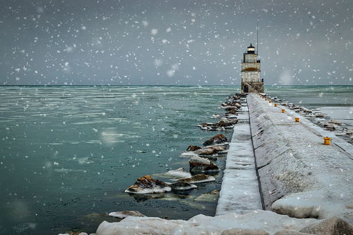 December on Lake Michigan at the north pier and lighthouse in Manitowoc, Wisconsin.