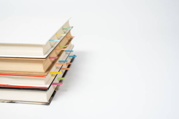 istock close up of book marked with placeholders on white background. 1024695644