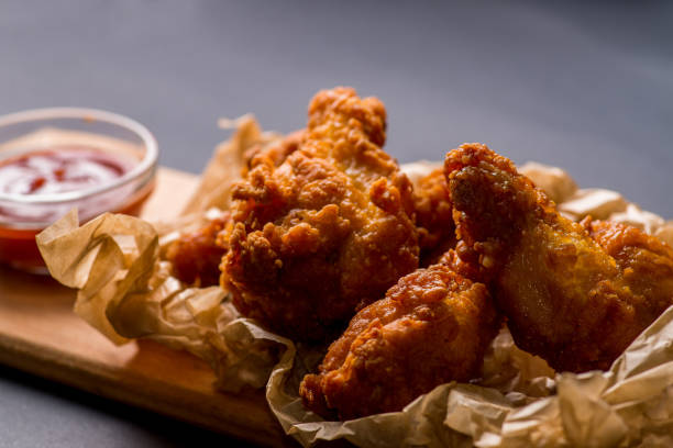 istock fried  chicken wings nuggets with ketchup 1024703440