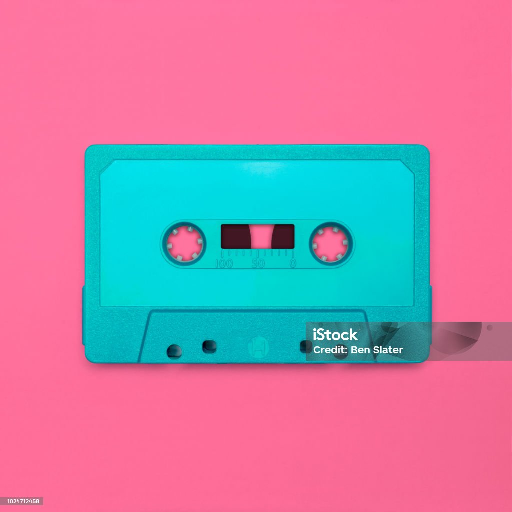 Cassette tape Nostalgic image of a cassette tape, isolated and presented in punchy pastel colors, blank for creative customization Retro Style Stock Photo