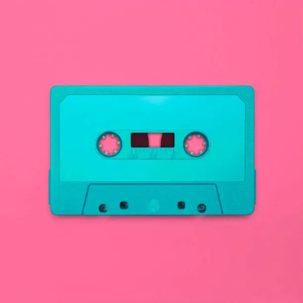 Nostalgic image of a cassette tape, isolated and presented in punchy pastel colors, blank for creative customization