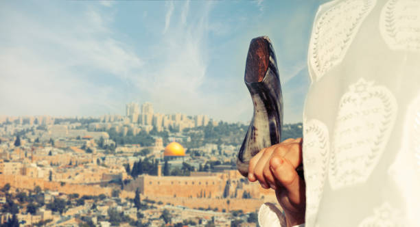 istock Jewish man blowing the Shofar in Jerusalem 1024713058