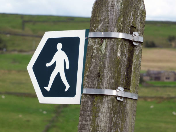 istock a  countryside walking direction sign indicating a path or public footpath or right of way in england 1024717044
